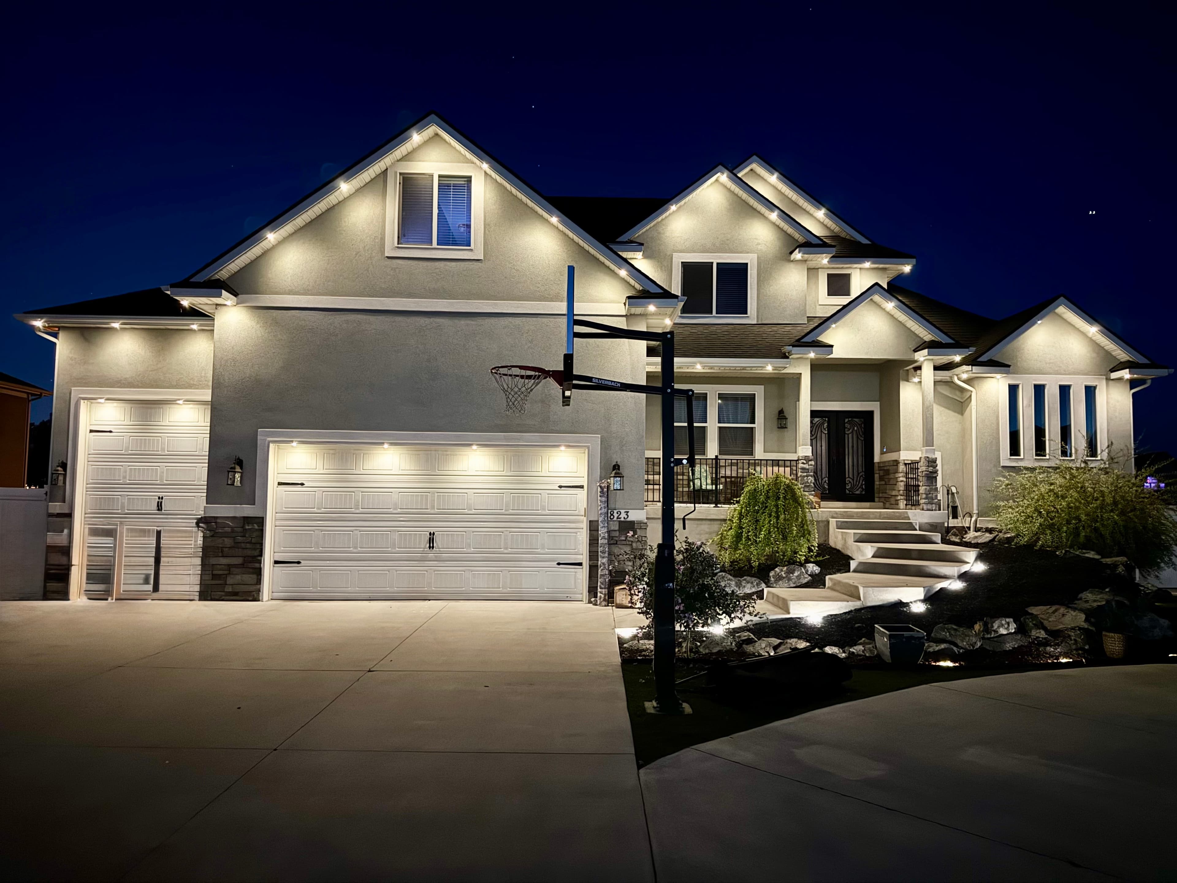 Smart outdoor LED lighting controlled via app on an Austin home