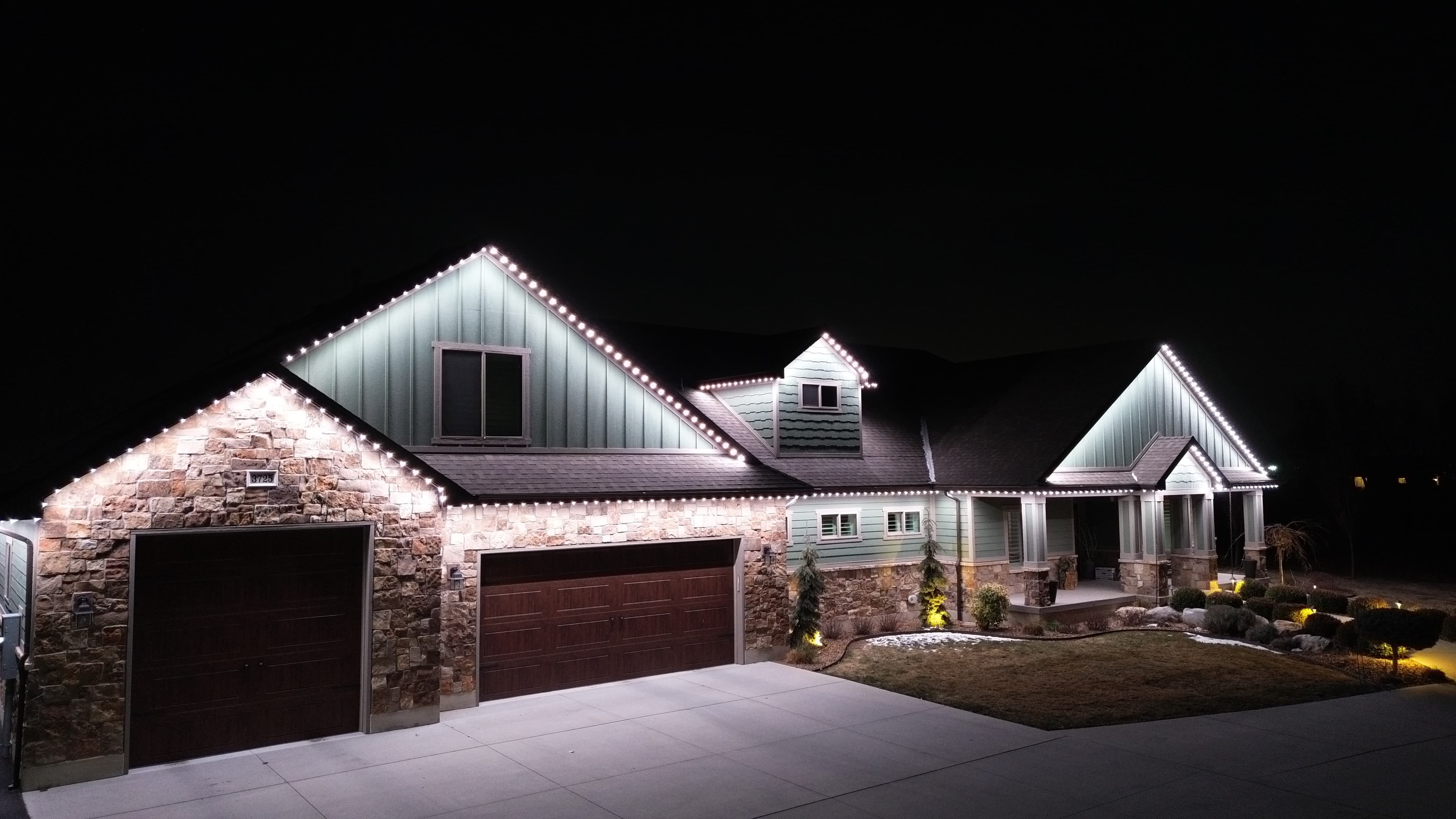Security lighting illuminating an Austin home at night