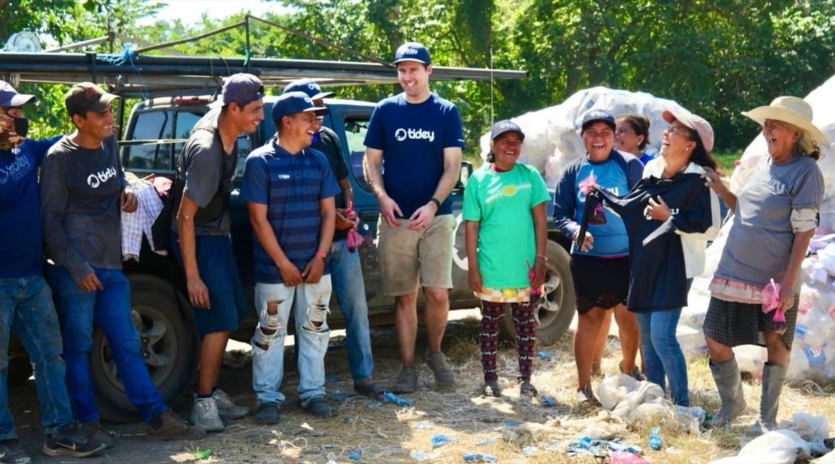 Tidey Ocean team and community members celebrating after a cleanup event