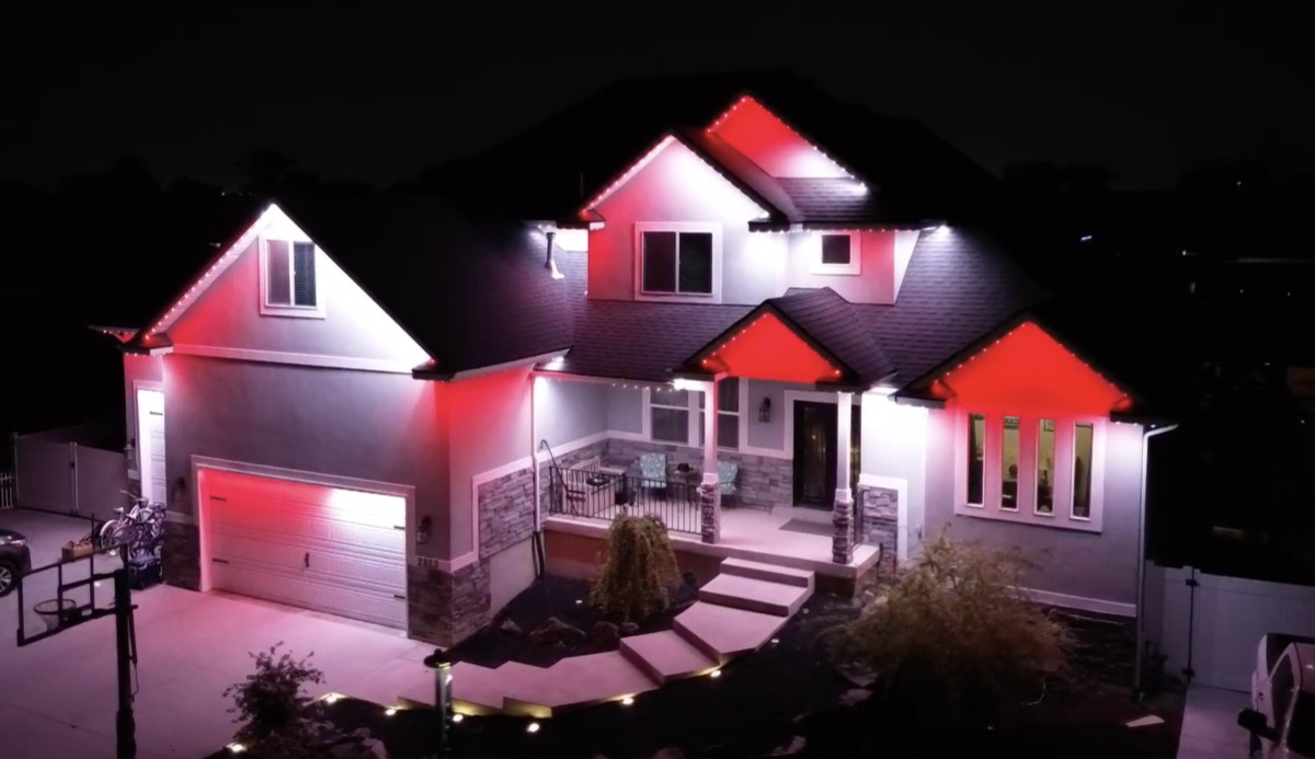 Permanent lighting displaying holiday colors on an Austin home, showing year-round versatility
